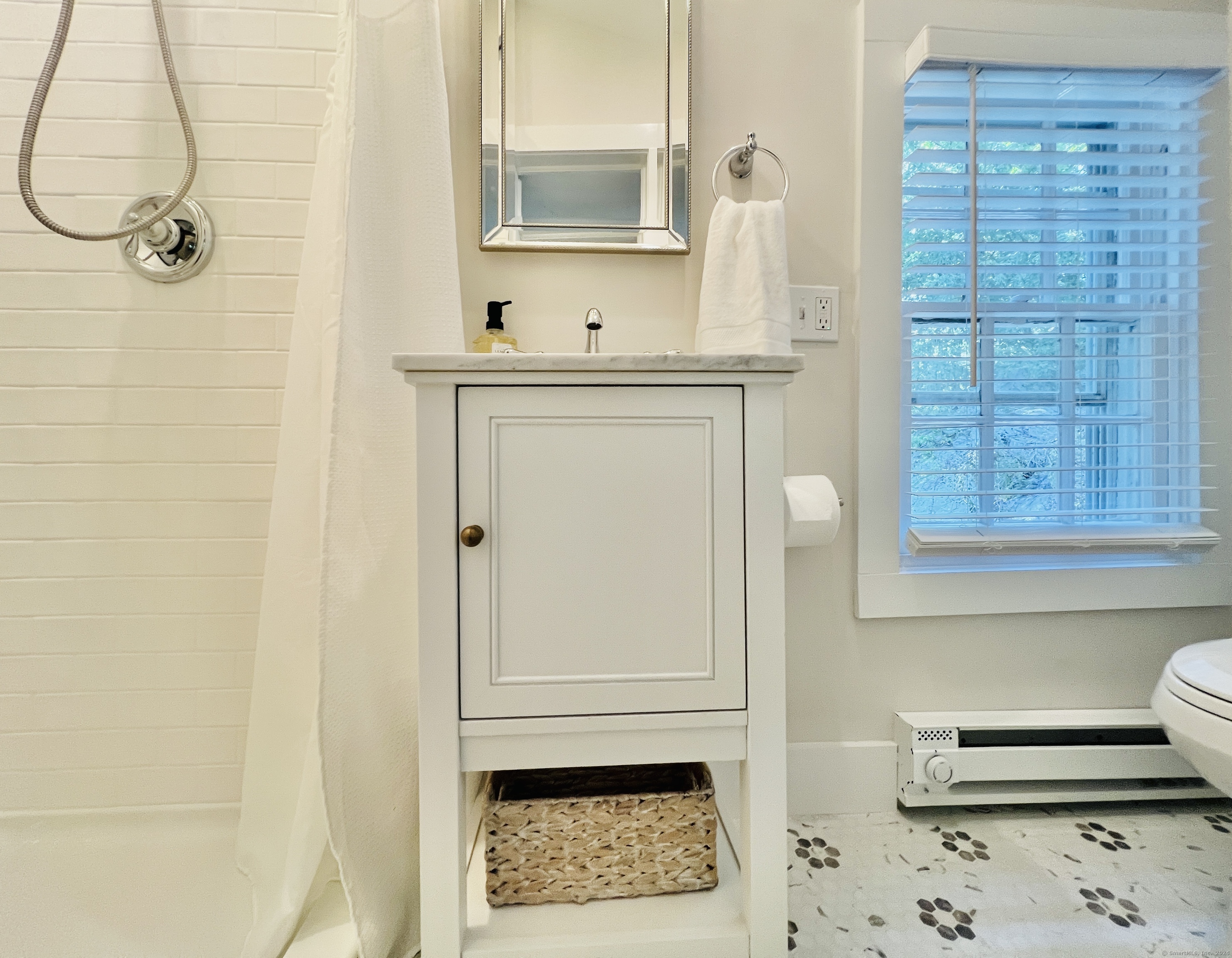 301 Haviland Road Stamford, CT 06903 - Photo 22 of 34 a bathroom with a sink a mirror and a shower
