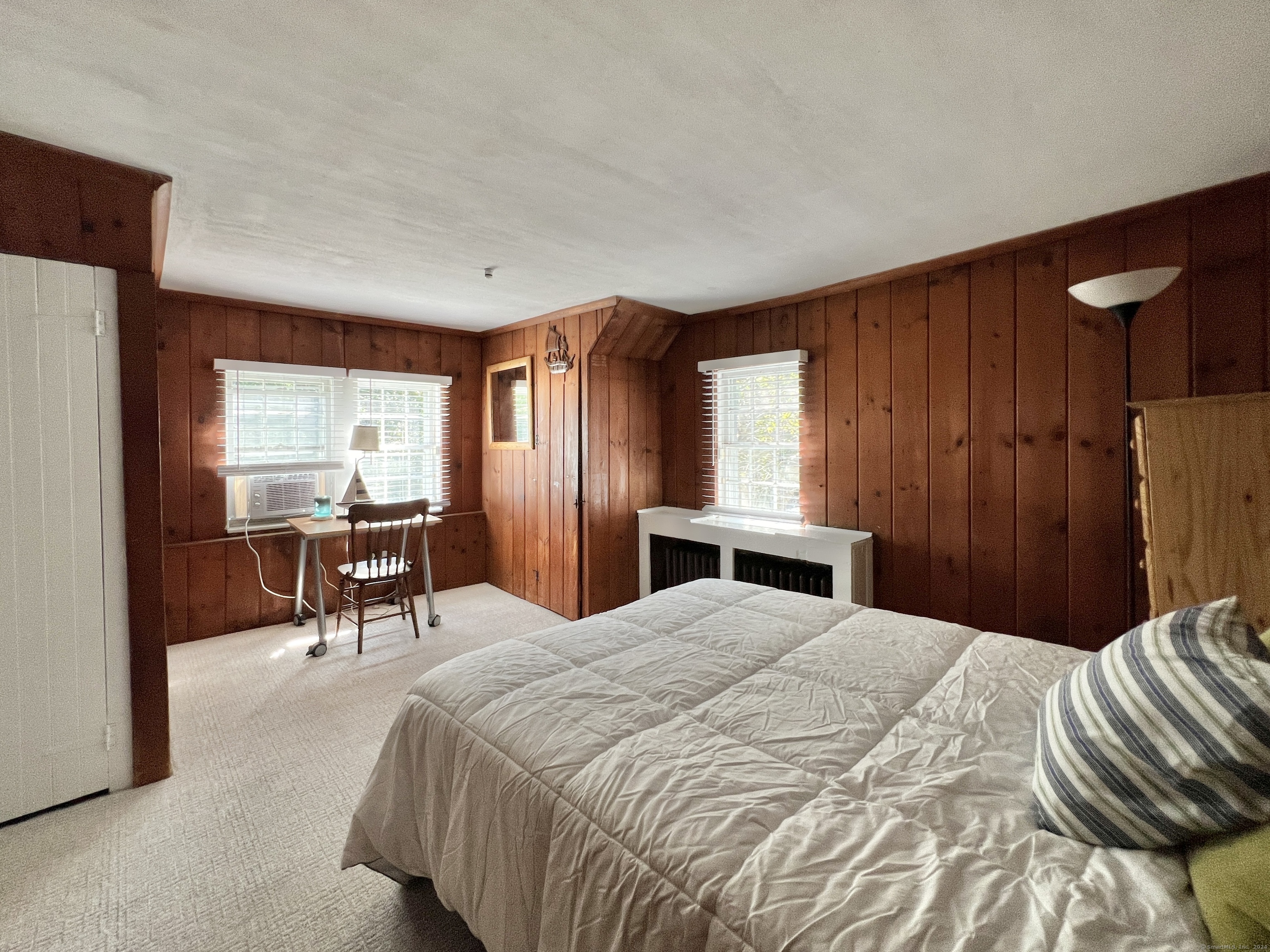 301 Haviland Road Stamford, CT 06903 - Photo 28 of 34 a bedroom with a bed and a chandelier