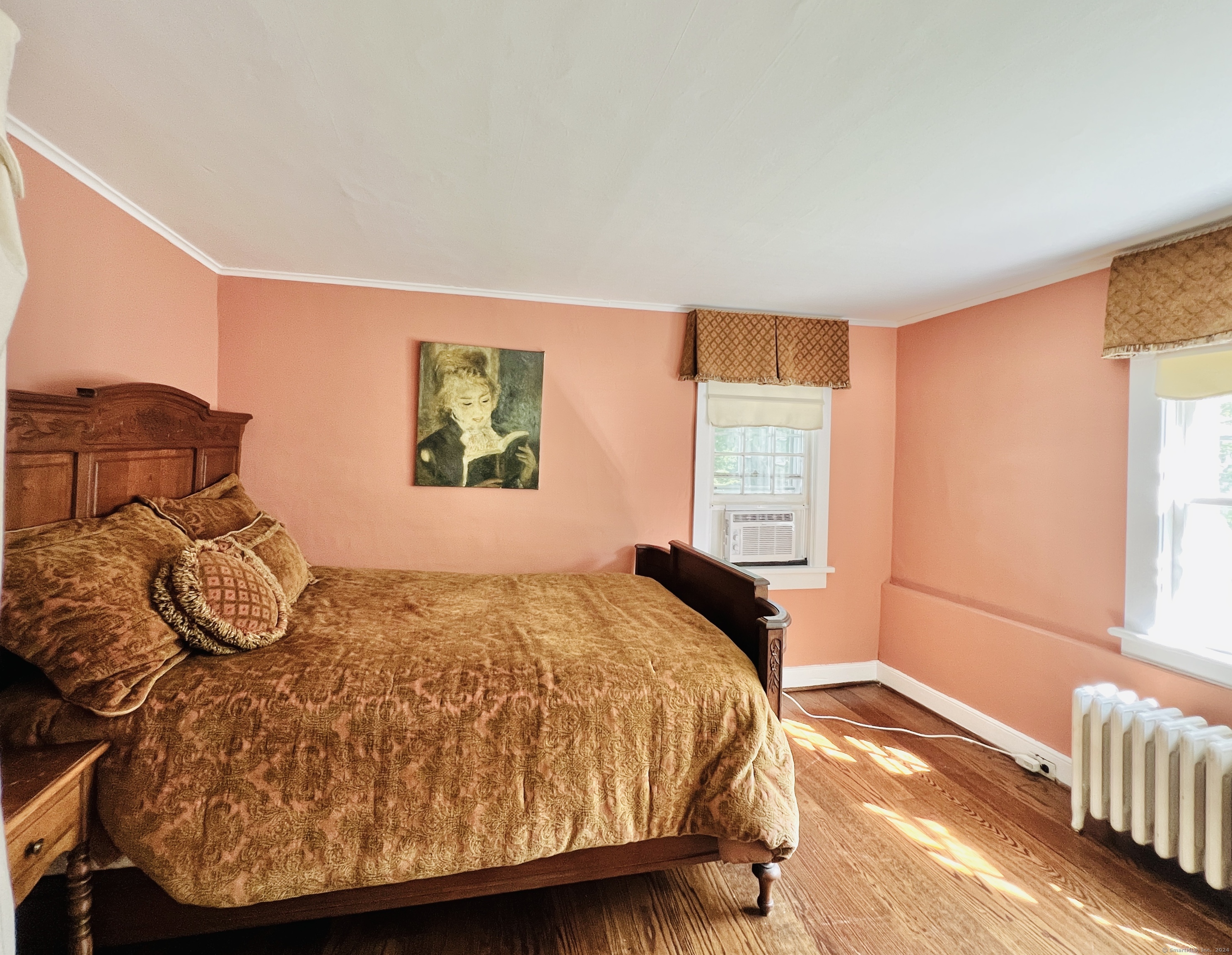 301 Haviland Road Stamford, CT 06903 - Photo 29 of 34 a bedroom with a bed and wooden floor