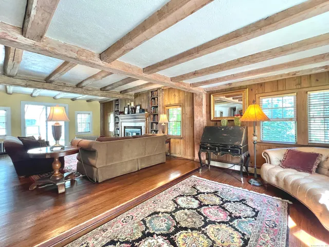 a living room with furniture and a table