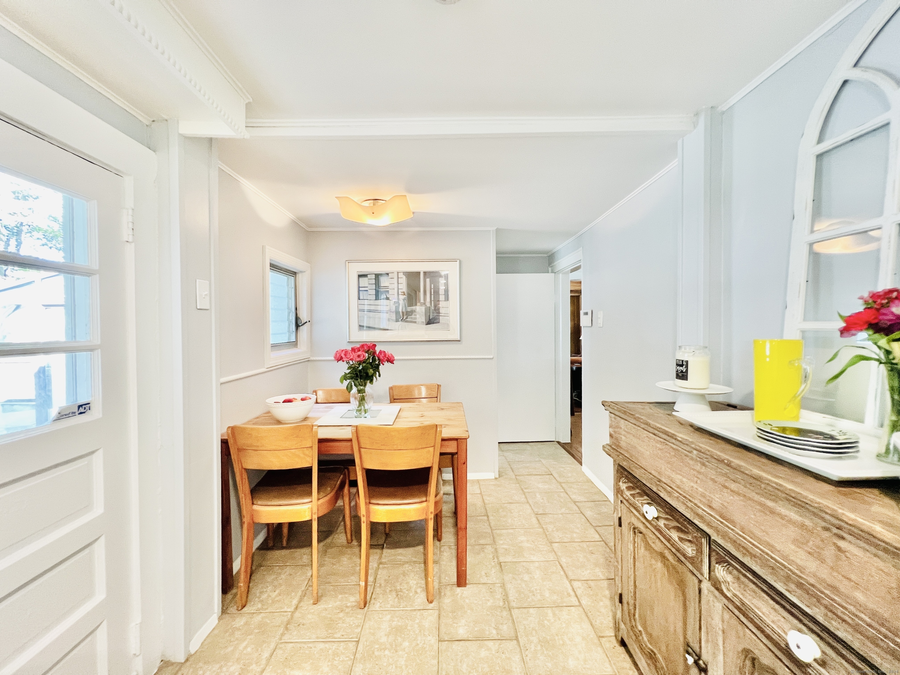 301 Haviland Road Stamford, CT 06903 - Photo 10 of 34 a view of a dining room with furniture and a potted plant