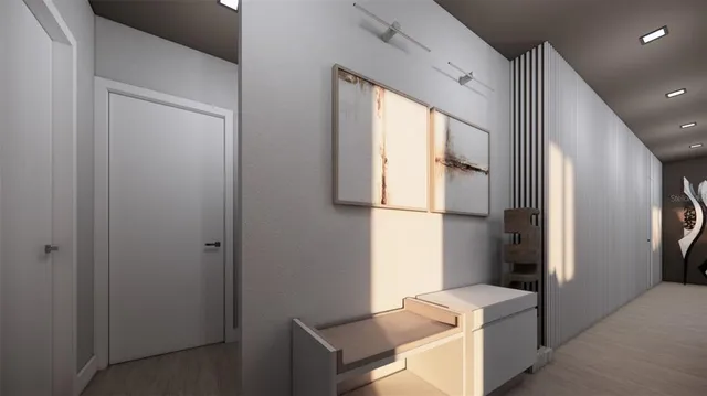 a view of hallway with couch and a window