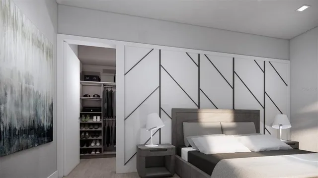 a bedroom with a bed and a book shelf