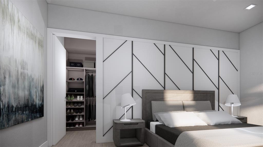 2344 Bay Street Sarasota, FL 34237 - Photo 14 of 23 a bedroom with a bed and a book shelf