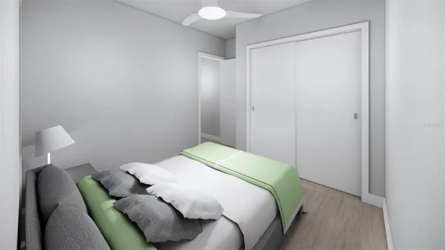 a bedroom with a bed and a chair