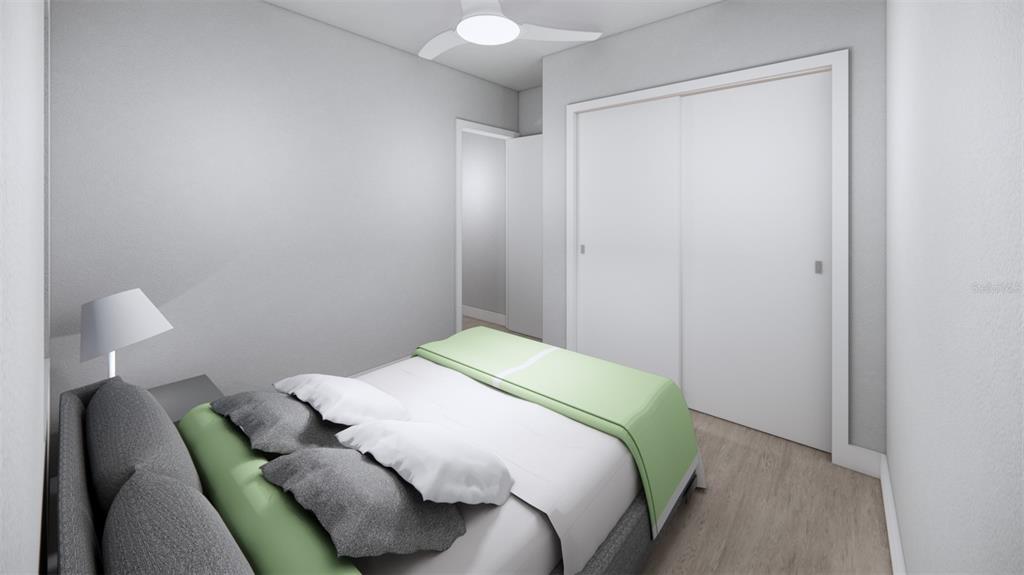 2344 Bay Street Sarasota, FL 34237 - Photo 19 of 23 a bedroom with a bed and a chair