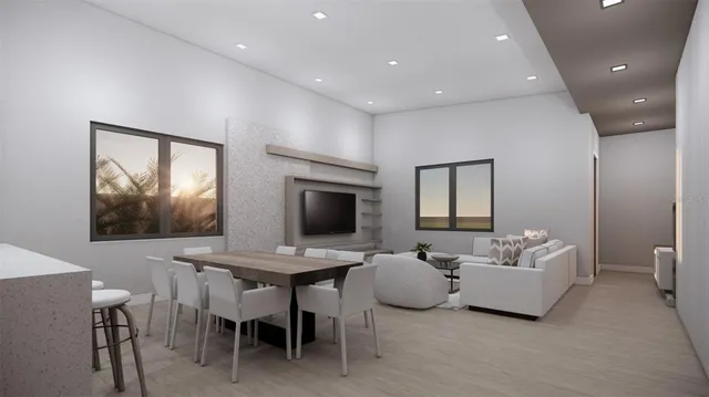 a living room with furniture a flat screen tv and a window