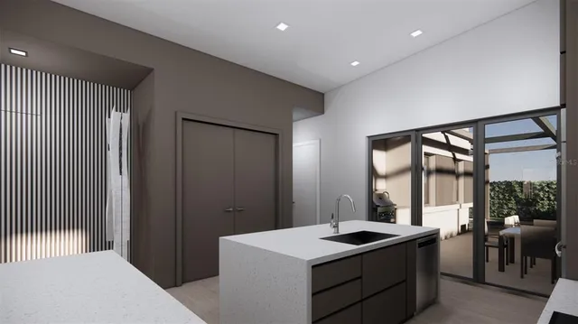 a kitchen with a sink and a refrigerator