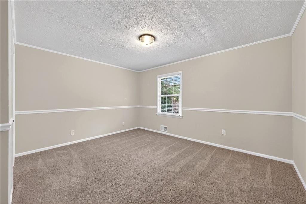 187 Old Timber Road Lawrenceville, GA 30046 - Photo 25 of 32 a view of an empty room with a window