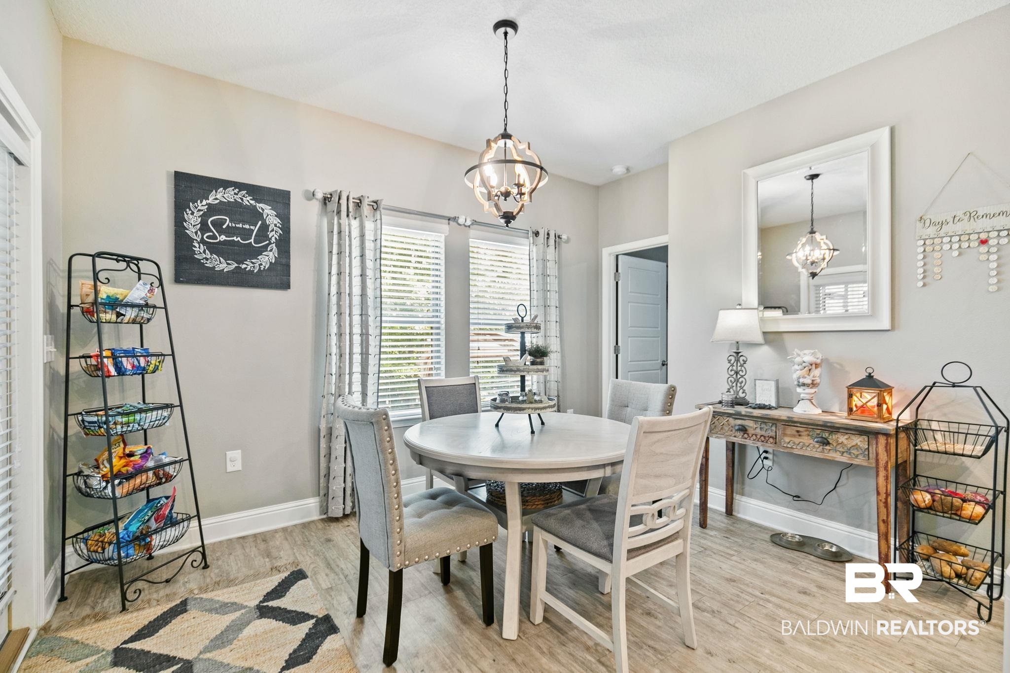 31402 Hoot Owl Road Daphne, AL 36527 - Photo 12 of 43 Dining area with light hardwood / wood-style flooring and an inviting chandelier