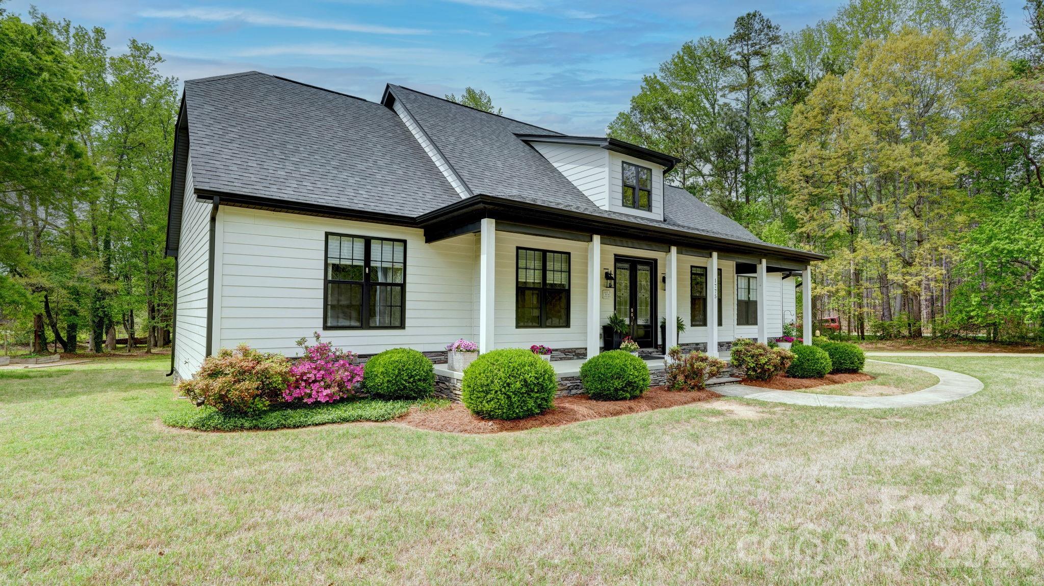 1775 Enochville Road Kannapolis, NC 28081 - Photo 29 of 41 a front view of a house with garden