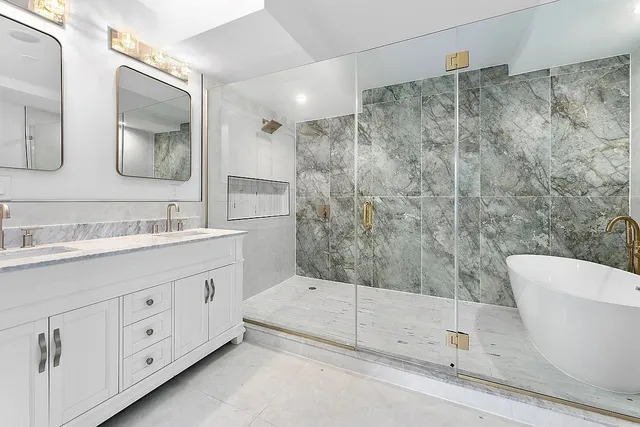 a bathroom with a double vanity sink and mirror