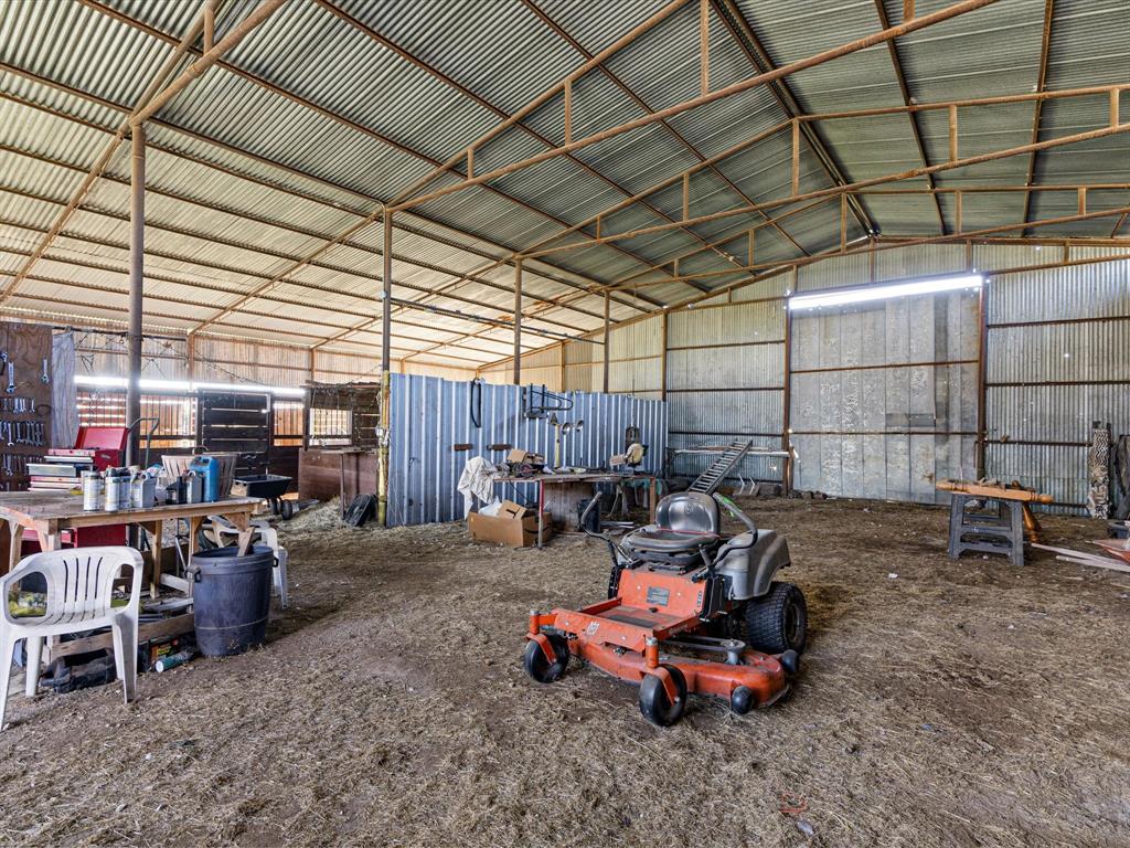 117 County Road 2646 Decatur, TX 76234 - Photo 26 of 39 a backyard of a house with barbeque oven table and chairs