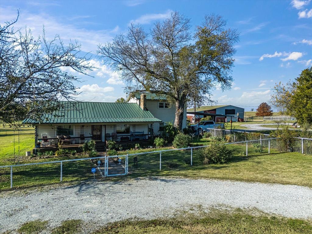 117 County Road 2646 Decatur, TX 76234 - Photo 37 of 39 a front view of a house with a yard table and chairs