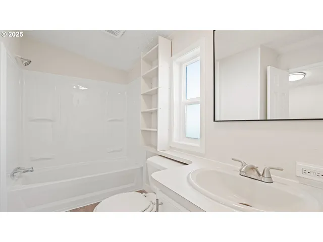 a black and white photo of a living room