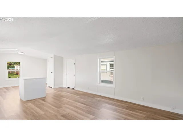 a open hall with a wooden floor