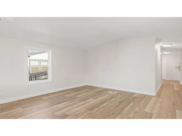 a open area with a bench and vanity