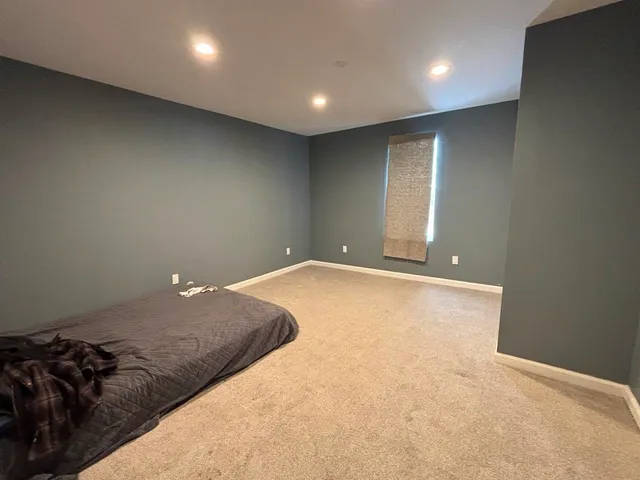 a view of a big room with windows