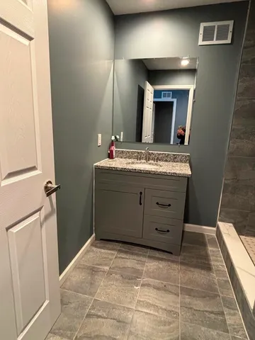 a view of a kitchen with cabinets
