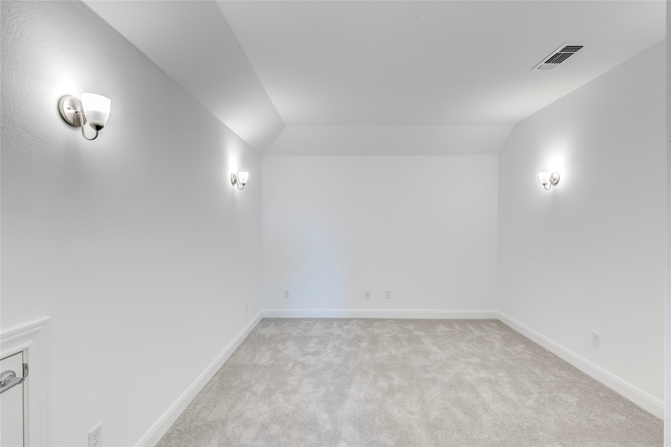 132 Inlet Lane Leander, TX 78641 - Photo 24 of 36 Additional living space featuring light colored carpet and vaulted ceiling