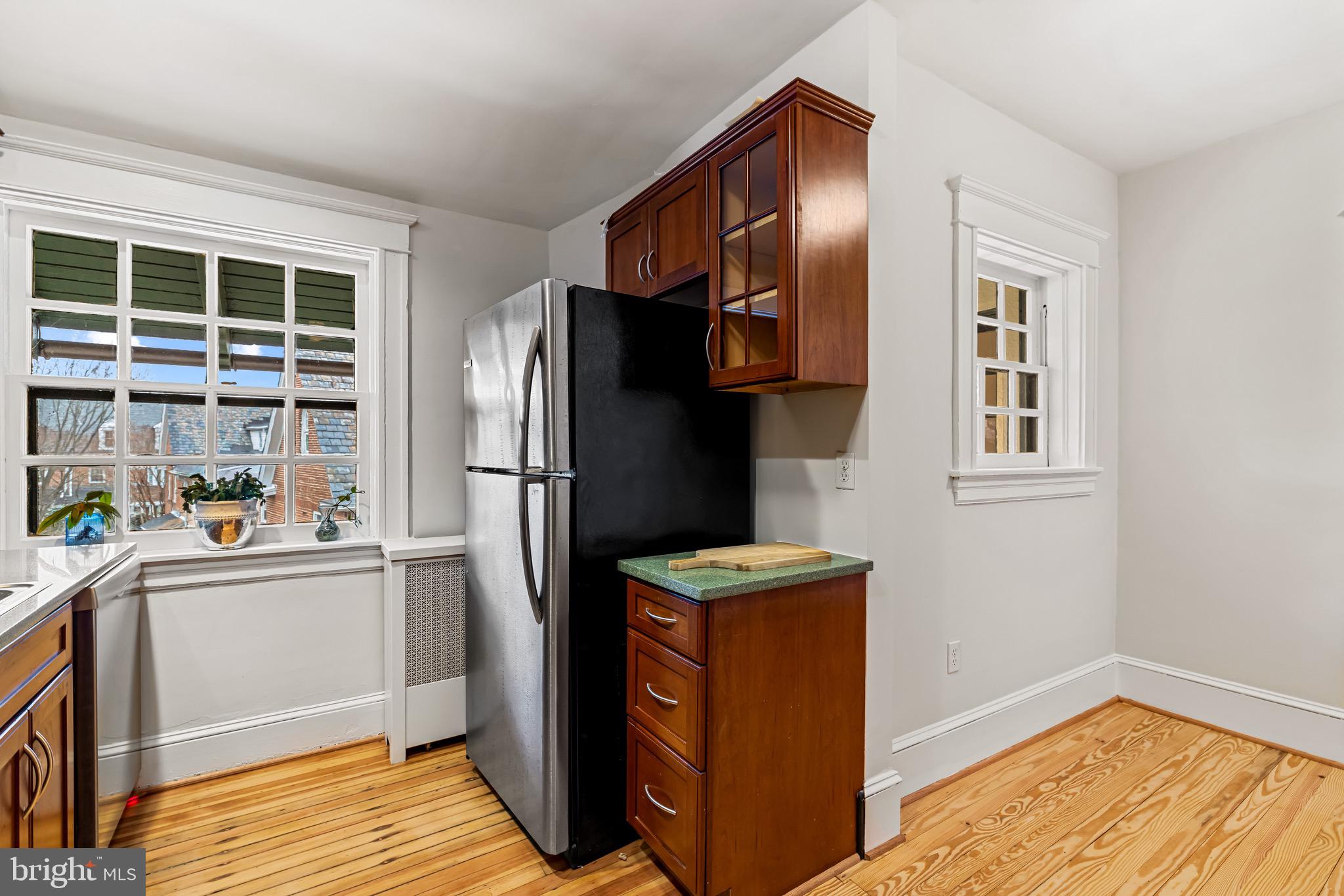 4300 Roland Avenue, Unit 302 Baltimore, MD 21210 - Photo 13 of 43 a kitchen with stainless steel appliances granite countertop a refrigerator and a sink