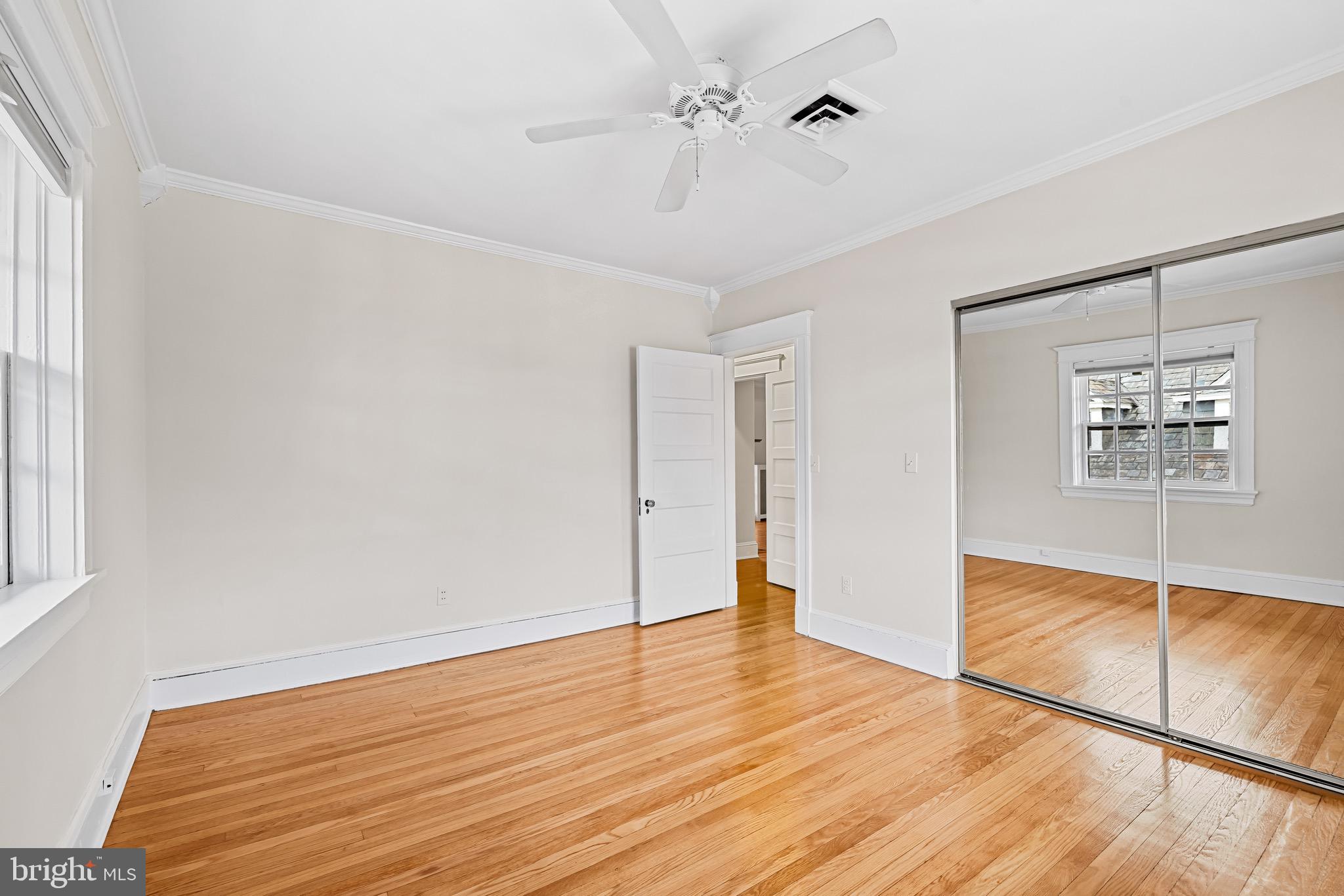 4300 Roland Avenue, Unit 302 Baltimore, MD 21210 - Photo 20 of 43 a view of empty room with wooden floor and fan