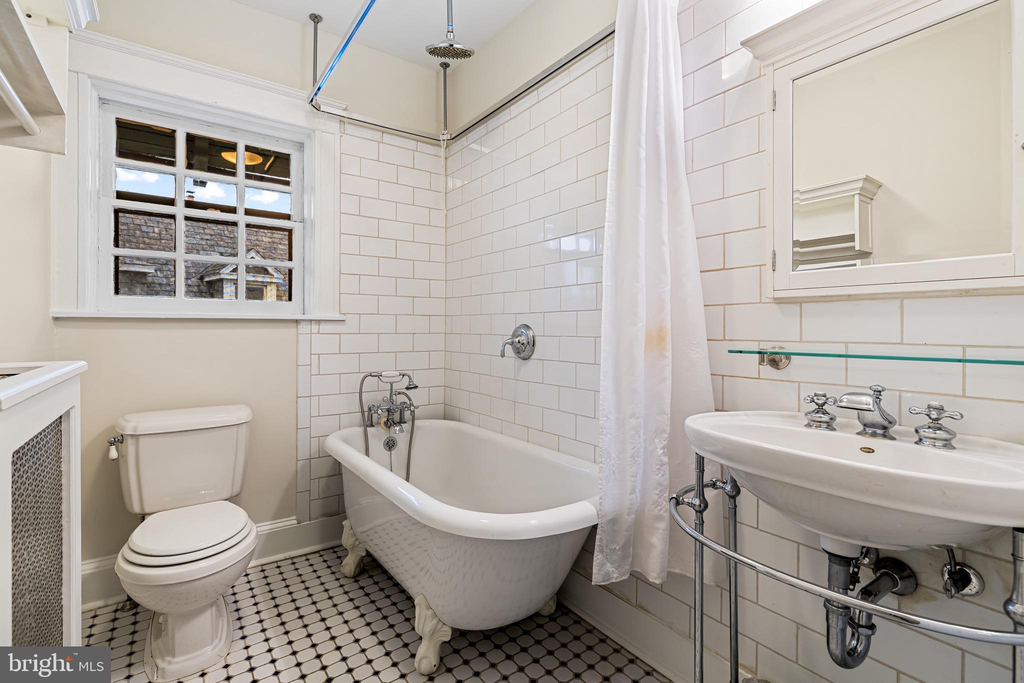 4300 Roland Avenue, Unit 302 Baltimore, MD 21210 - Photo 21 of 43 a bathroom with a sink toilet and shower