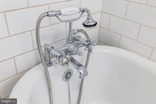 a close view of light fixtures and wood floor