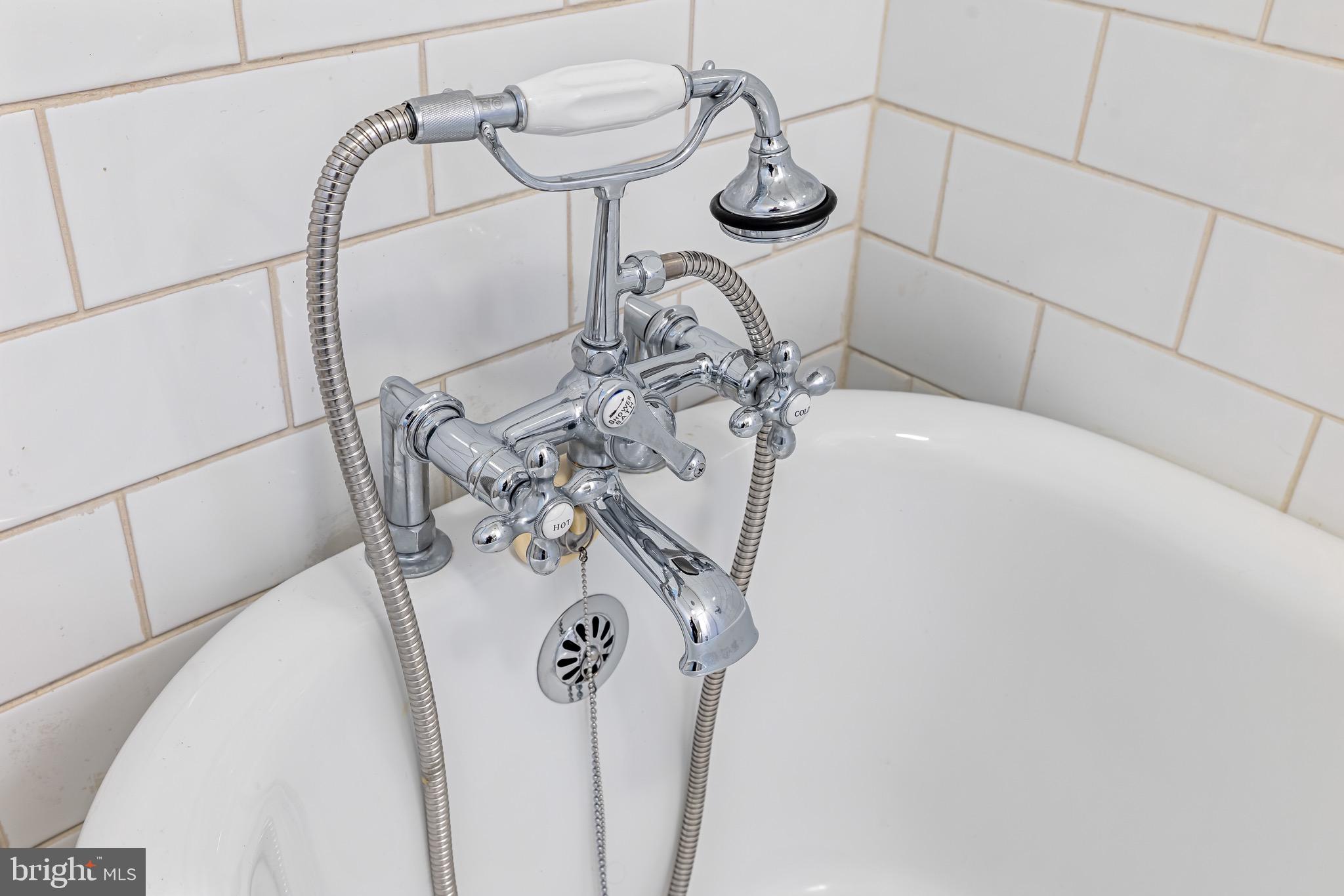 4300 Roland Avenue, Unit 302 Baltimore, MD 21210 - Photo 22 of 43 a close view of light fixtures and wood floor