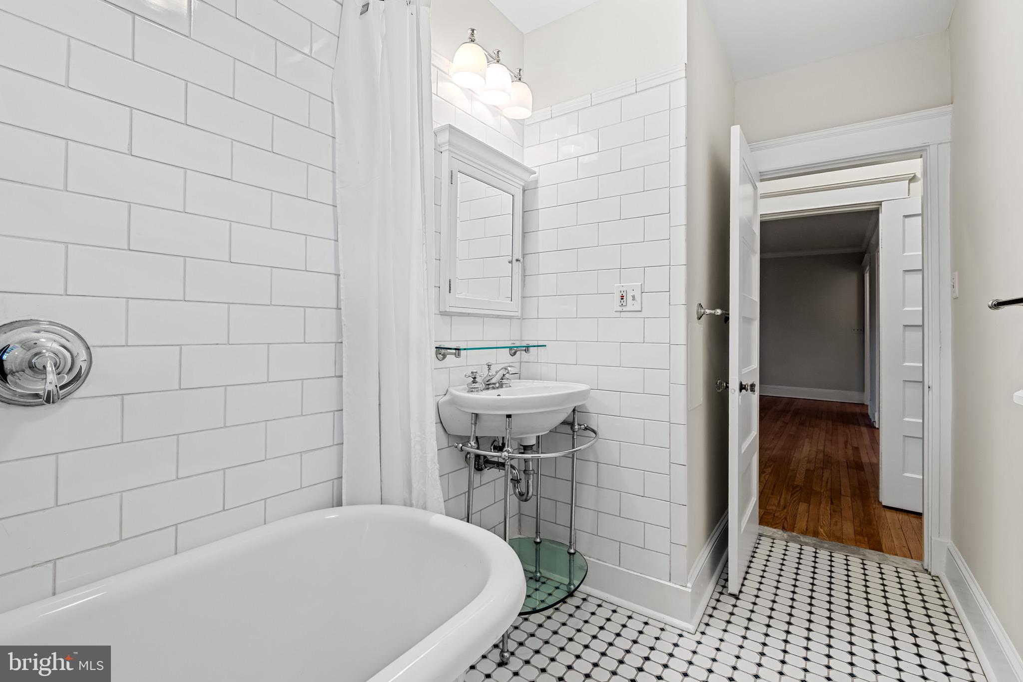 4300 Roland Avenue, Unit 302 Baltimore, MD 21210 - Photo 24 of 43 a bathroom with a sink and a shower