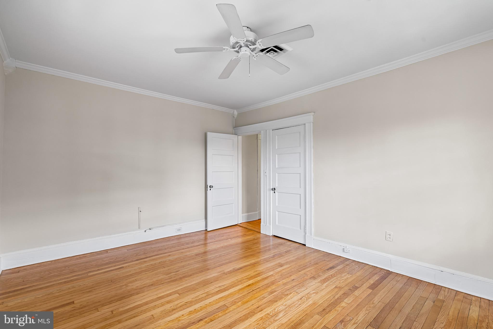 4300 Roland Avenue, Unit 302 Baltimore, MD 21210 - Photo 28 of 43 a view of an empty room with wooden floor