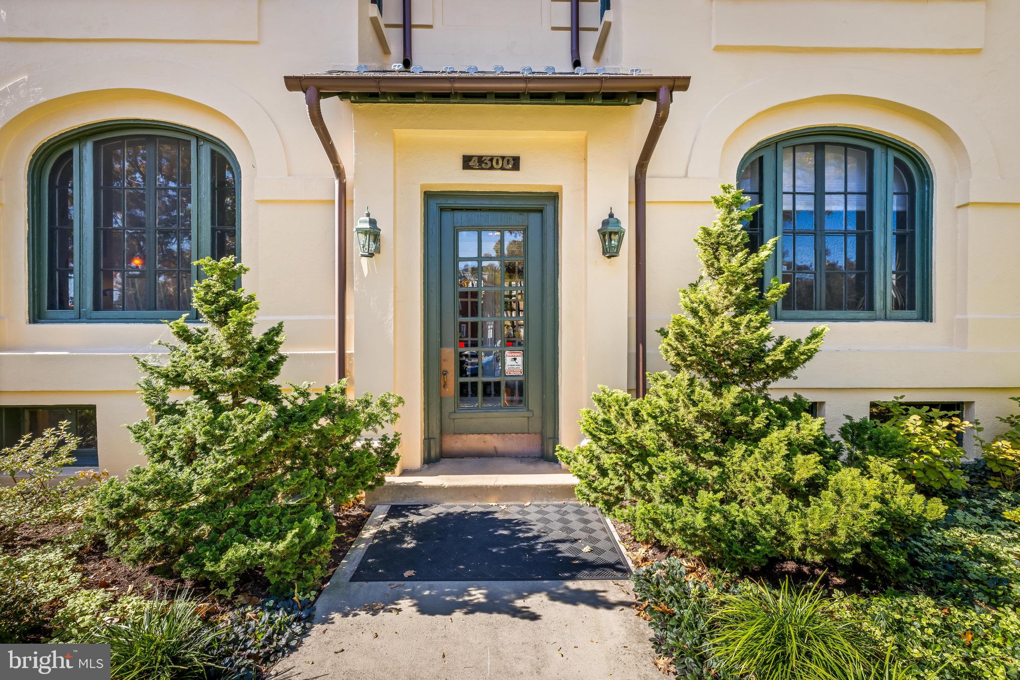 4300 Roland Avenue, Unit 302 Baltimore, MD 21210 - Photo 32 of 43 a front view of a house with garden