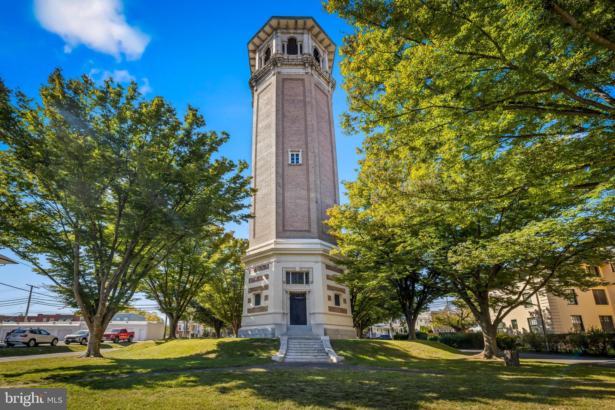 4300 Roland Avenue, Unit 302 Baltimore, MD 21210 - Photo 36 of 43 a front view of a house with a garden and trees