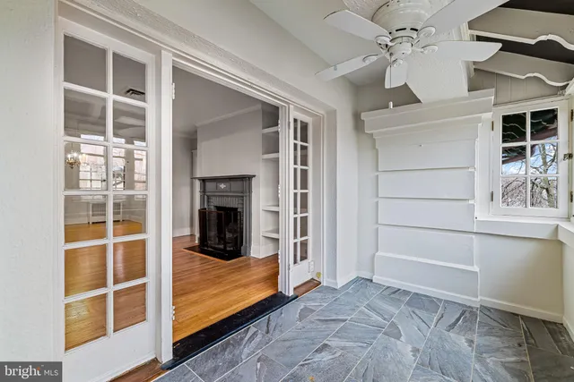 a view of a bedroom with a bed and a window