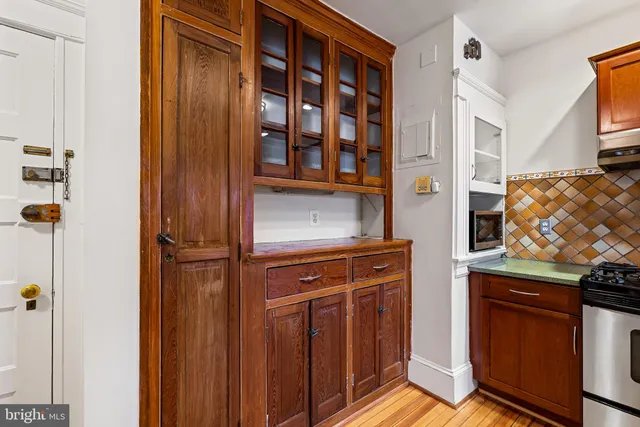 a view of front door with wooden floor