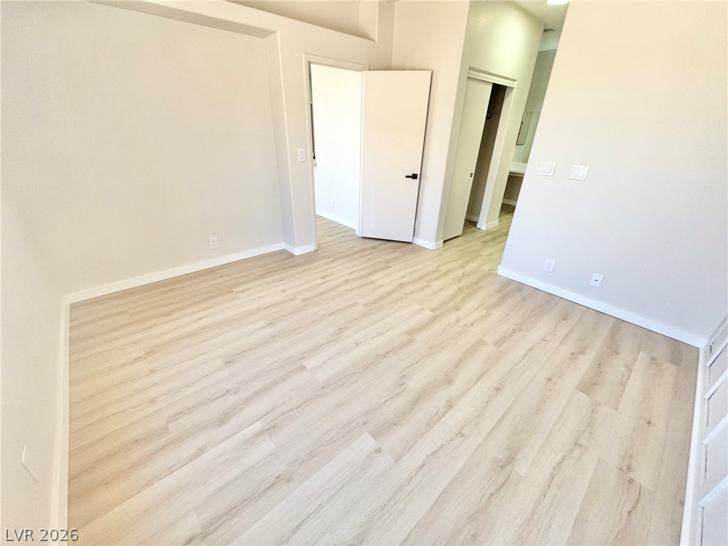 7340 Ridge Star Court Las Vegas, NV 89131 - Photo 19 of 22 Blonde wood flooring creates a welcoming space in this well-appointed living area.