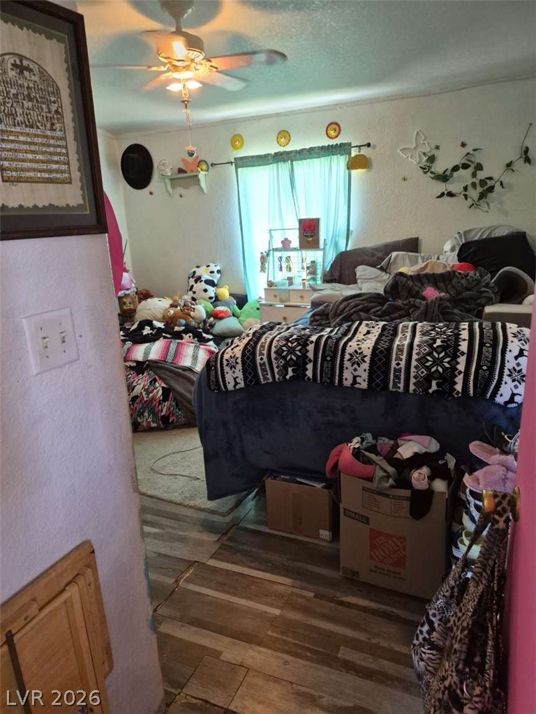 2271 Tough Boy Road Pahrump, NV 89060 - Photo 11 of 12 Wood flooring extends across this private sleeping sanctuary.