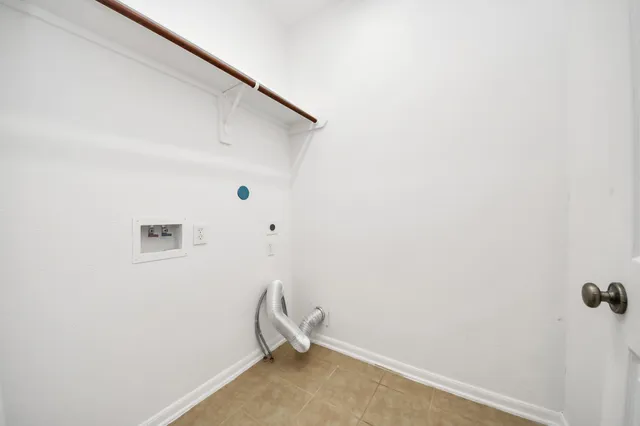 a view of small space with utility racks on the wall