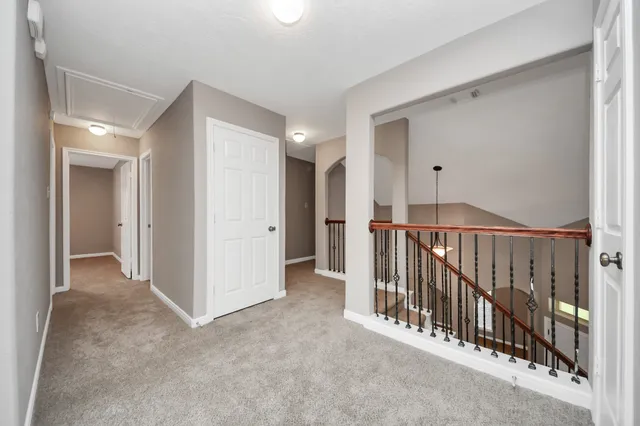 a view of a hallway with entryway and closet