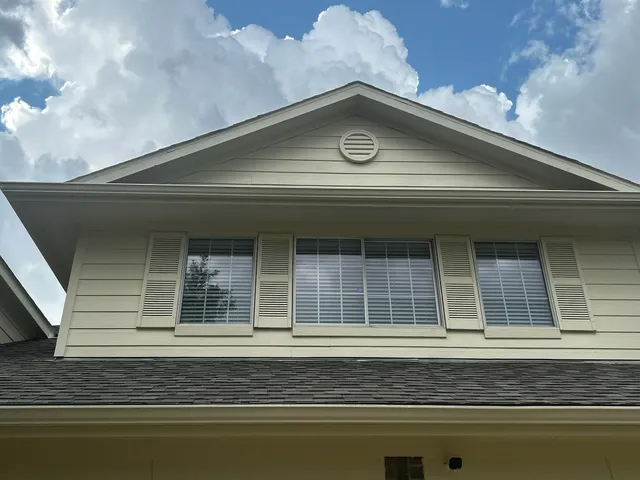 a front view of a house with garage and yard