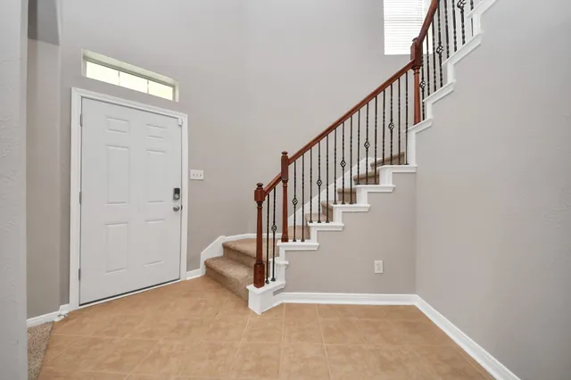 a view of an entryway with wooden floor