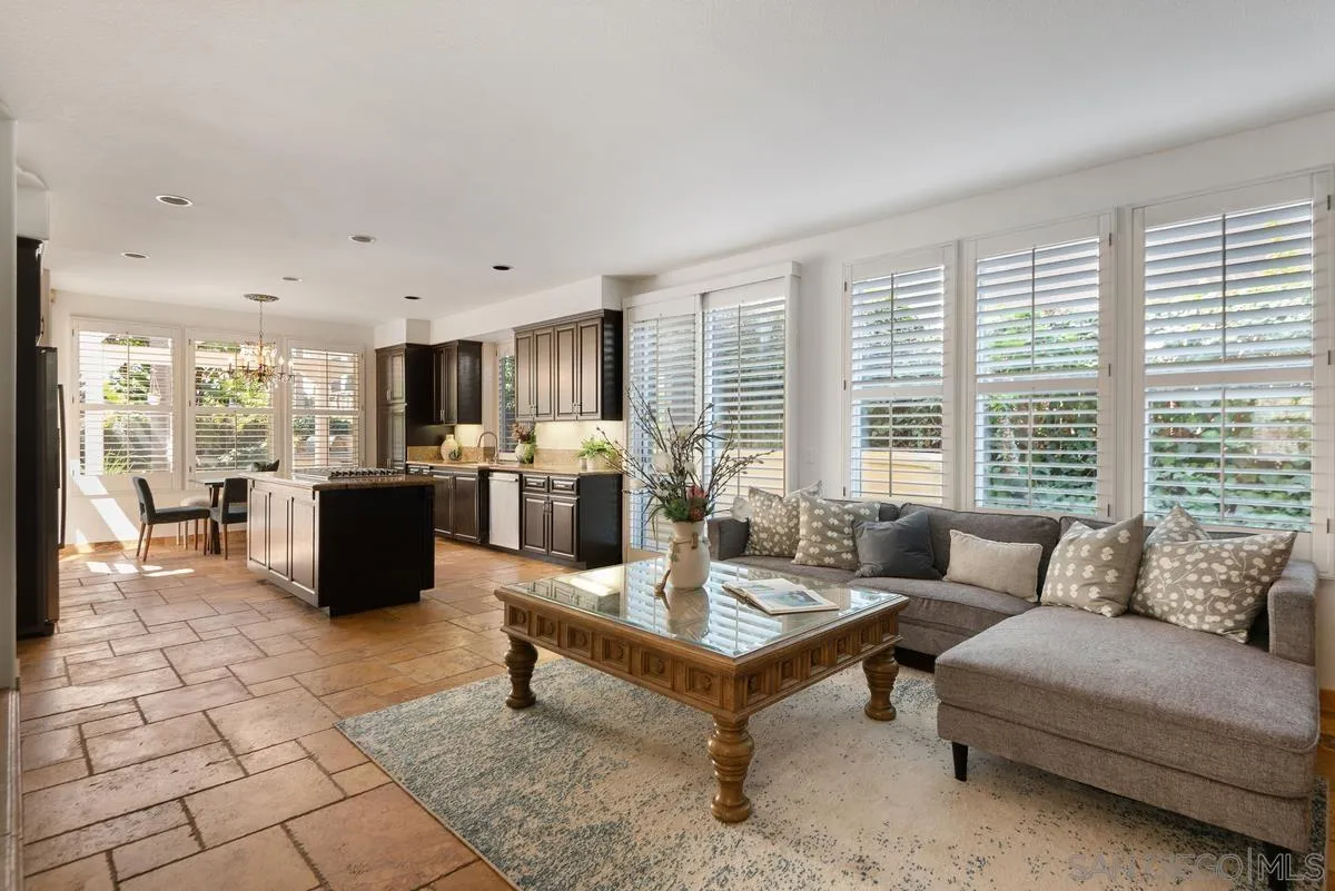 4889 Riding Ridge Road San Diego, CA 92130 - Photo 20 of 34 a living room with furniture and a table