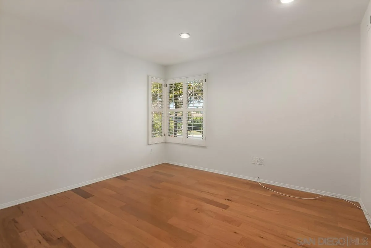 4889 Riding Ridge Road San Diego, CA 92130 - Photo 27 of 34 an empty room with a window