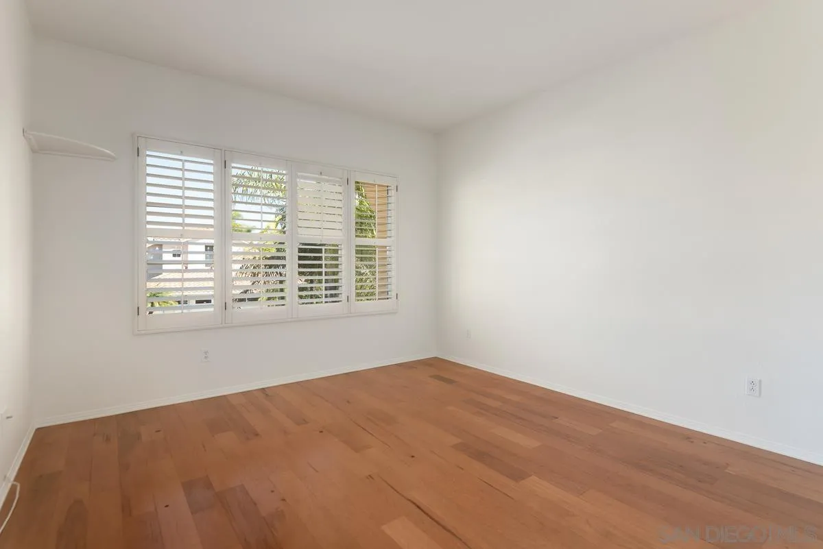 4889 Riding Ridge Road San Diego, CA 92130 - Photo 29 of 34 a view of an empty room with a window