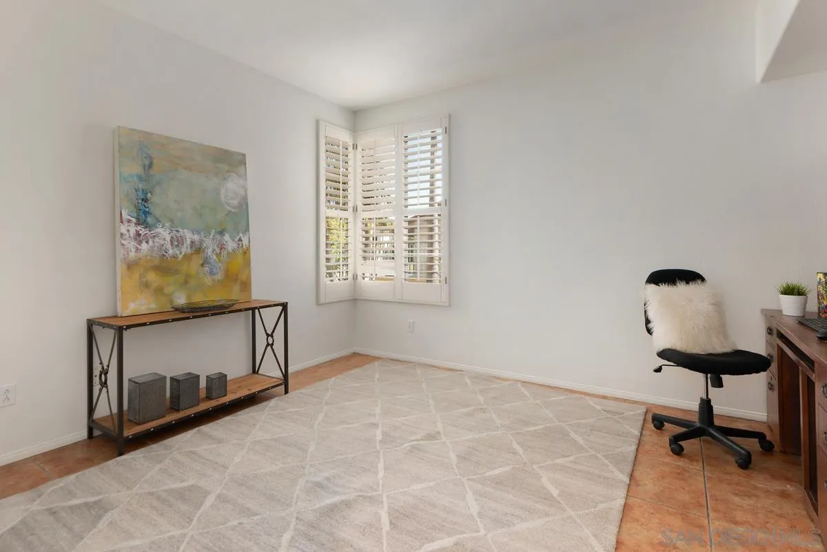 4889 Riding Ridge Road San Diego, CA 92130 - Photo 31 of 34 a view of an empty room with a window