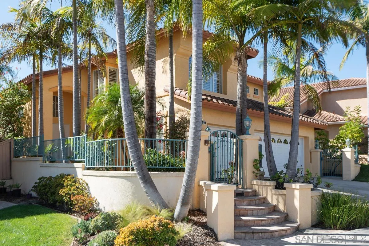 4889 Riding Ridge Road San Diego, CA 92130 - Photo 4 of 34 a front view of multi story residential apartment building with yard and green space