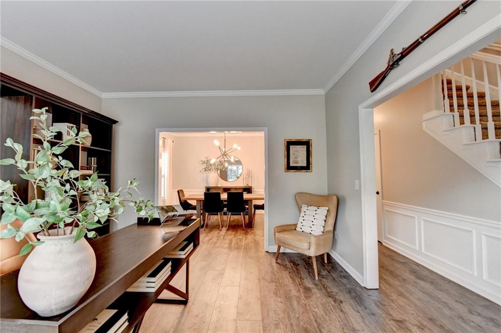 1130 Rome Drive Roswell, GA 30075 - Photo 11 of 96 a living room with furniture floor to ceiling window and wooden floor