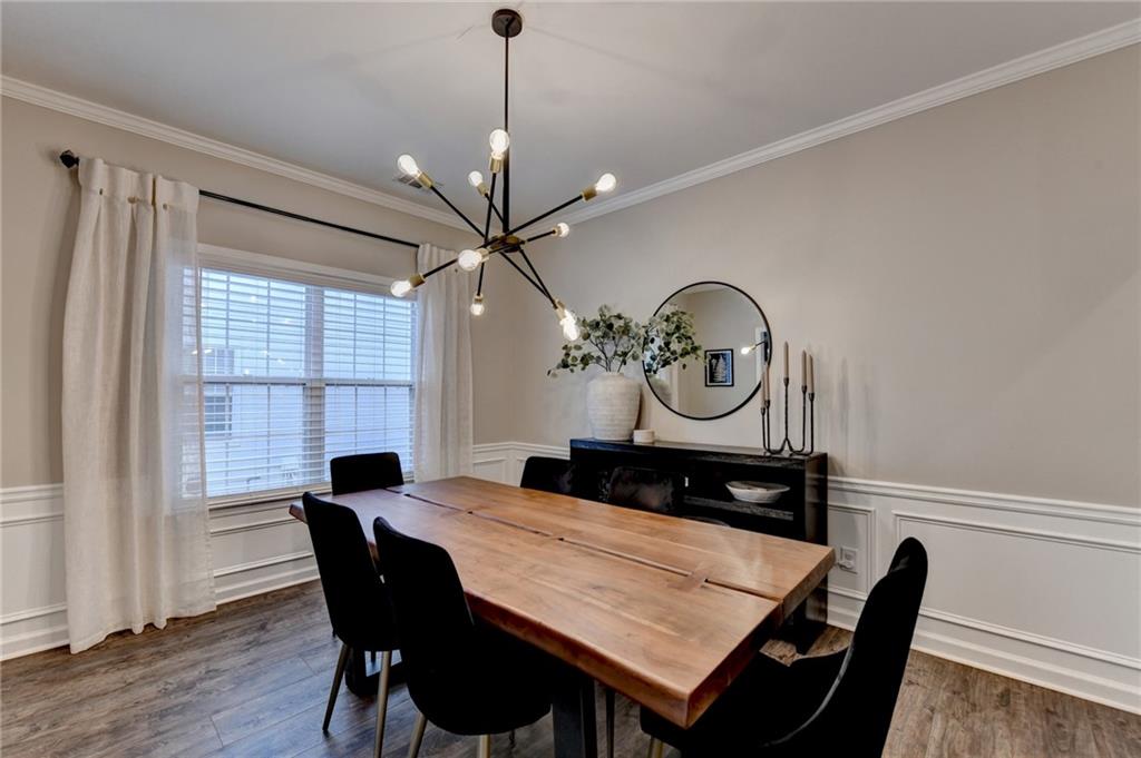1130 Rome Drive Roswell, GA 30075 - Photo 15 of 96 a view of a dining room with furniture window and wooden floor