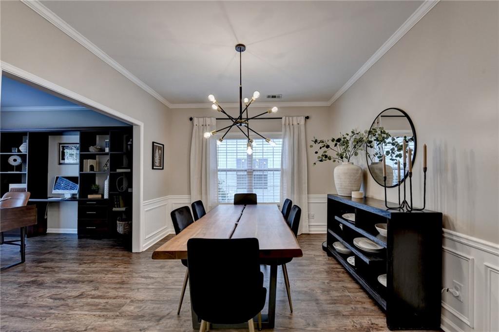 1130 Rome Drive Roswell, GA 30075 - Photo 16 of 96 a view of a dining room with furniture window and wooden floor