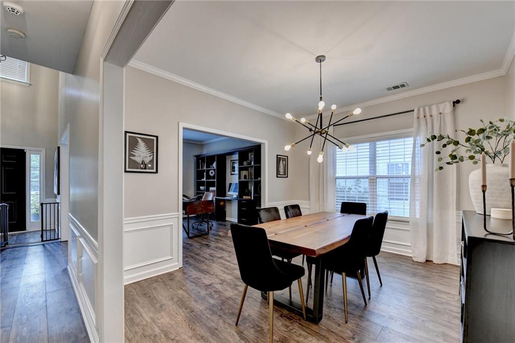 1130 Rome Drive Roswell, GA 30075 - Photo 17 of 96 a view of a dining room with furniture window and wooden floor